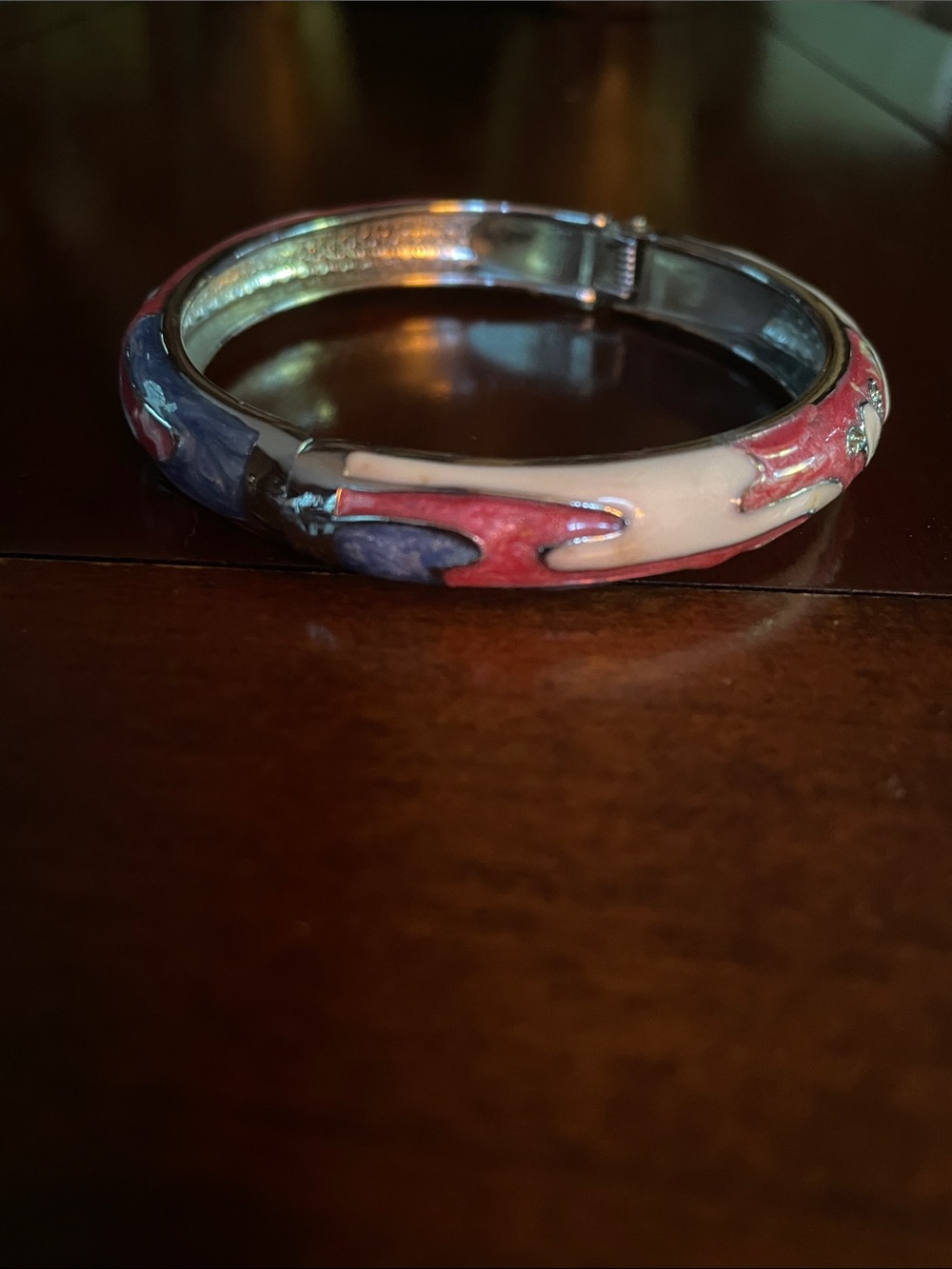 Gorgeous enamel and metal bracelet. Opens easily